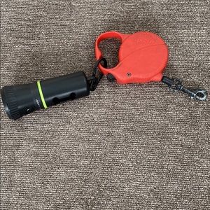 Dog leash for a small dog with disposable bag holder and flashlight
